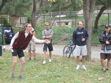 Lare Dog playing horseshoes
